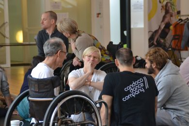 Group of disabled and non-disabled people in discussion